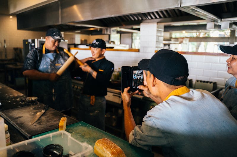 Pizzana kitchen team preparing pizzas